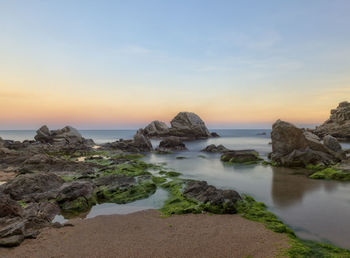 Scenic view of sea against sky during sunset