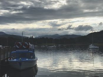 Boat in lake against sky