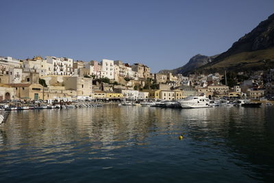 Boats on sea at castellammare del golfo