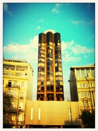 Low angle view of building against cloudy sky