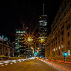 Illuminated light trails on road at night