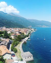 High angle view of townscape by sea