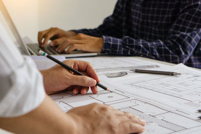 Low angle view of man working on table