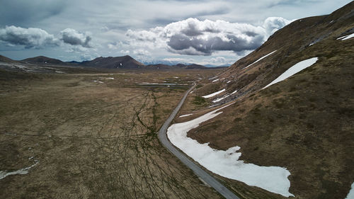 Scenic view of mountains against sky during winter