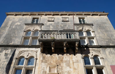 Low angle view of old building against sky