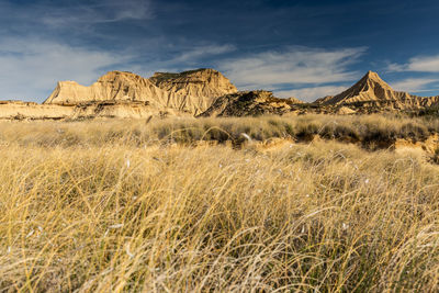 Rock formations on landscape against sky