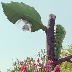 Low angle view of flowers against sky