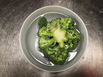 High angle view of broccoli in bowl on sink
