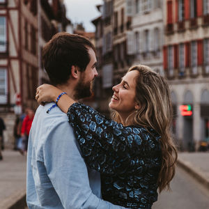 Young couple kissing in city