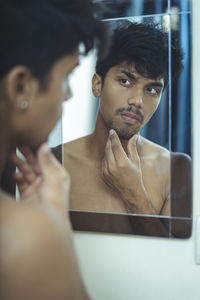 Portrait of young man looking away