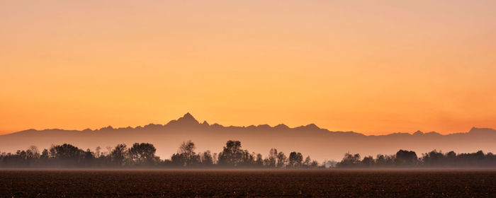 Scenic view of silhouette landscape against sky during sunset