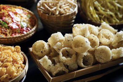 Rengginang lorjuk.  sticky rice cracker  with lorjuk clams. it is arranged among other crackers.