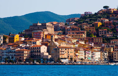 Buildings in city at waterfront