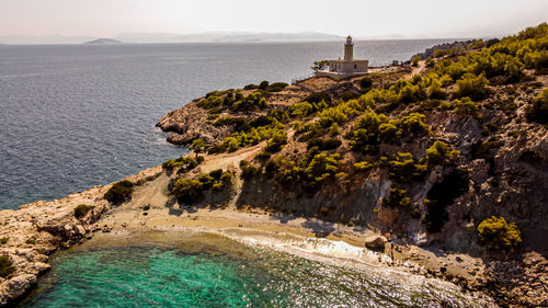 The lighthouse and the grean beach