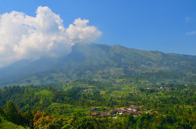 Scenic view of landscape and mountains against sky