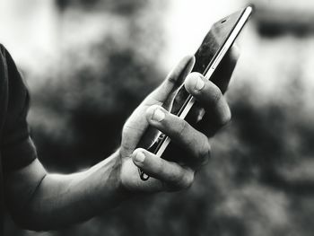 Close-up of hand holding outdoors