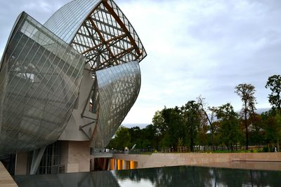 Reflection of cloudy sky on glass structure