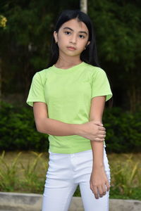 Portrait of girl standing outdoors