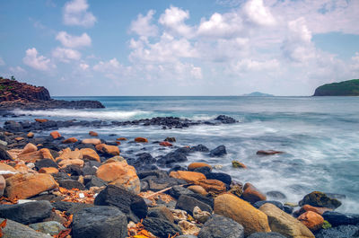 Scenic view of sea shore against sky