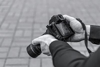 Photographer reviewing captured photos on camera