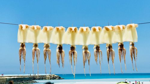 Panoramic view of swimming pool against clear blue sky