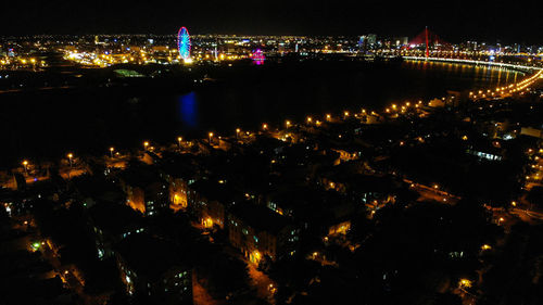 High angle view of illuminated buildings at night