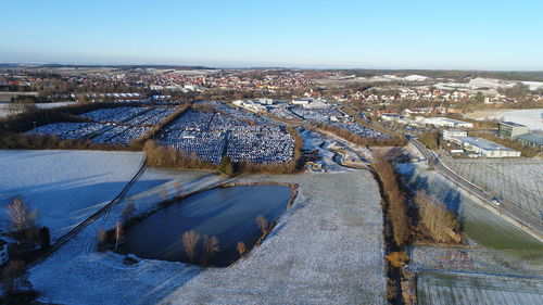 High angle view of cityscape against clear blue sky