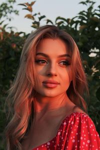 Portrait of young woman, beautiful sexy attractive girl enlightened by sunset.