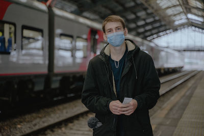Respiratory disease coronavirus in russia, ukraine. man in a medical mask on the platform. pandemic