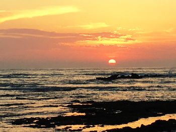 Scenic view of sea at sunset