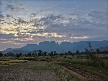 Scenic view of field against sky during sunset