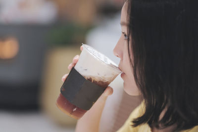 Close-up of woman drinking coffee