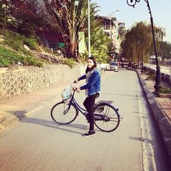 Man riding bicycle on road