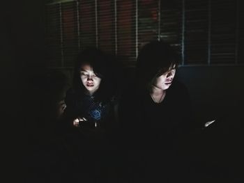 Young couple in dark room