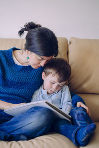 Mom and son on sofa at home