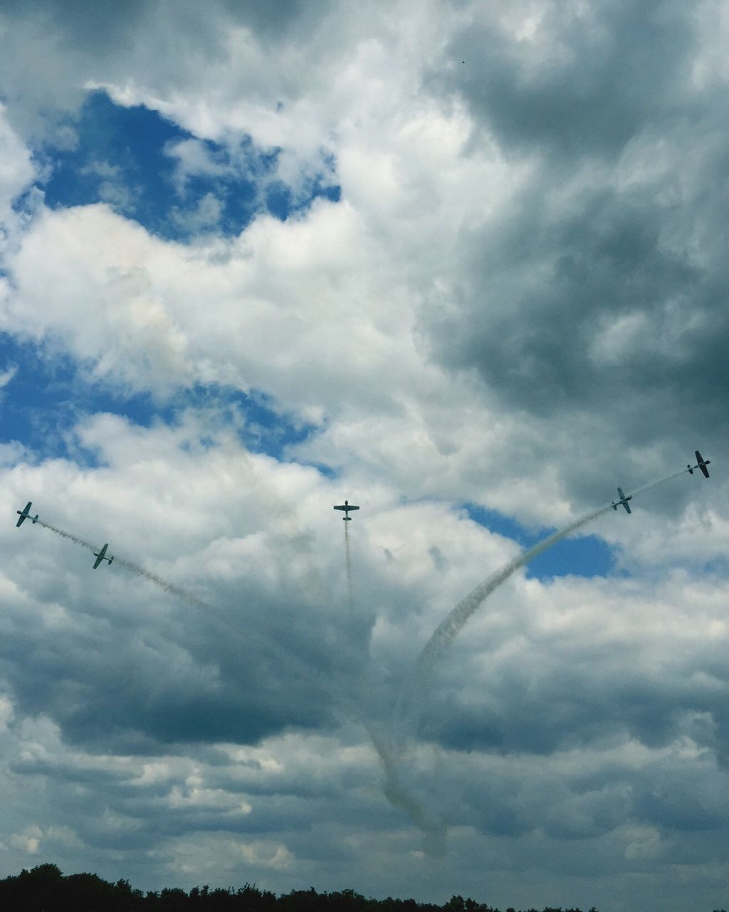 low angle view, sky, flying, cloud - sky, cloudy, bird, animal themes, weather, silhouette, cloud, mid-air, overcast, animals in the wild, flock of birds, nature, wildlife, airplane, beauty in nature, day