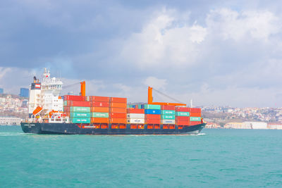 View of ship in sea against sky