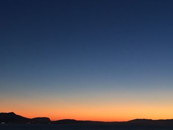 Scenic view of mountains at sunset