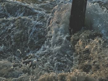 High angle view of water flowing through rocks