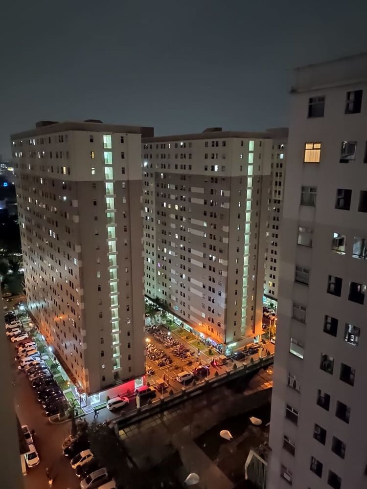 HIGH ANGLE VIEW OF ILLUMINATED BUILDINGS AGAINST SKY