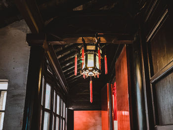 Low angle view of lantern hanging in building