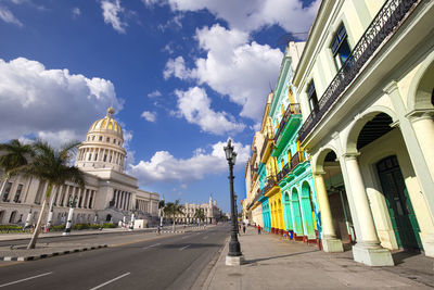 Road amidst buildings against sky in city