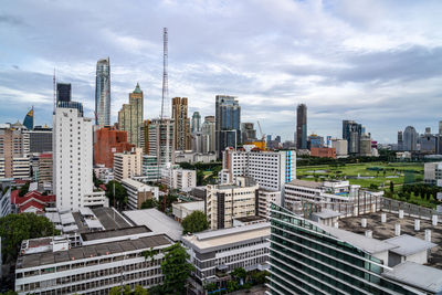 Cityscape against cloudy sky