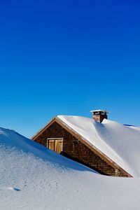 Building against clear blue sky during winter