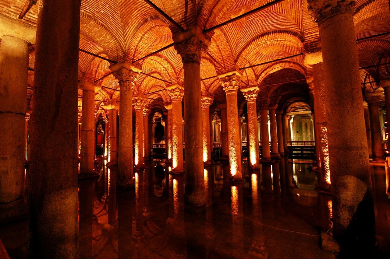 indoors, arch, religion, architecture, place of worship, church, built structure, spirituality, interior, architectural column, illuminated, corridor, window, ceiling, empty, cathedral, pew, history