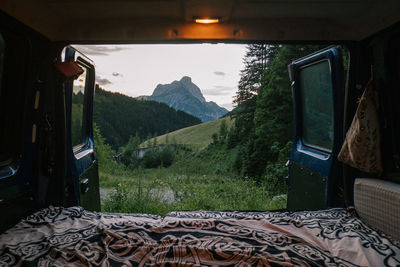 Scenic view of landscape seen through car windshield