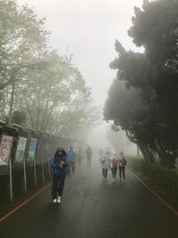 Men on road against sky