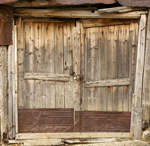 Closed wooden door of old house