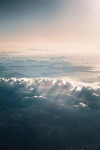Aerial view of sea against sky during sunset
