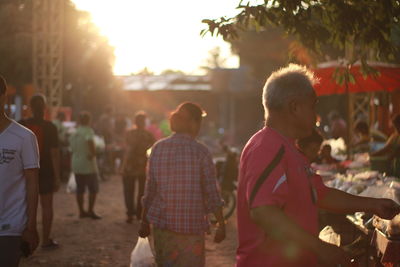 Group of people in park during sunset